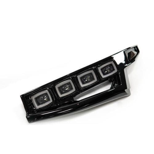 Close-up of a sleek, black LED car light with four square bulbs.