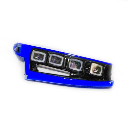 Close-up of a blue and black car headlight assembly.