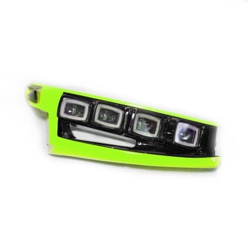 Bright green and black car headlight assembly with multiple lenses.