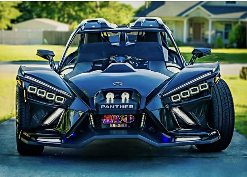 Sleek black Panther three-wheeled vehicle with futuristic design.
