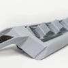 A sleek, modern gray device with angled vents and a dark grille section.