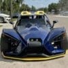 IMG-3209 A black Slingshot with a yellow bumper and hood