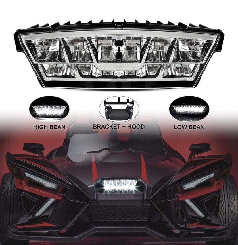 IMG_7221 A sleek, red three-wheeled vehicle with bold LED headlights and angular design.