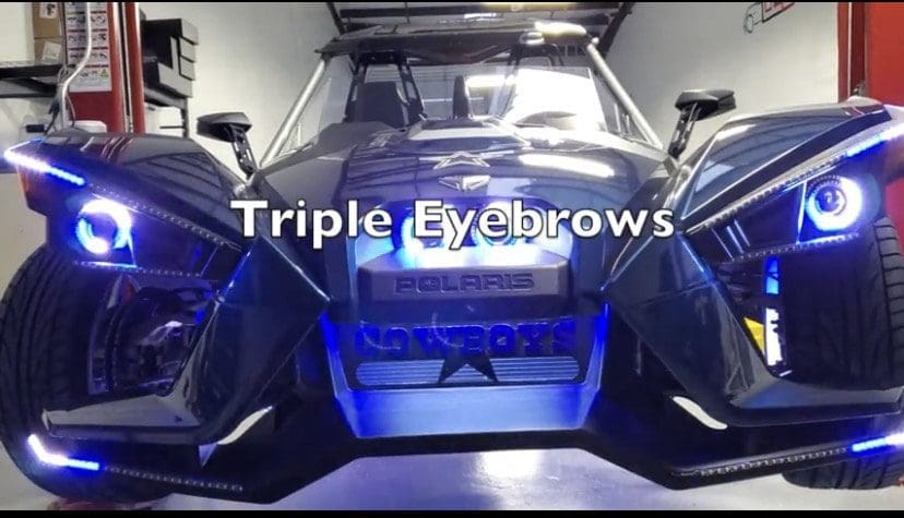 IMG_4047 A car with three windshield wipers labeled 'Triple Eyebrows'.