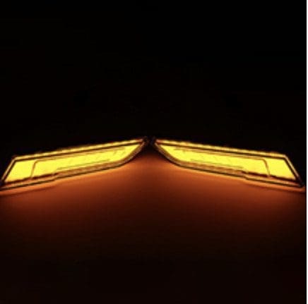 IMG_4140 Symmetrical yellow lights glowing against a dark background.