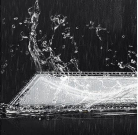 IMG_4141 Black and white aerial view of a water body with a dock and boats.
