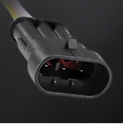 IMG_4142 Close-up of a black electrical connector plug with three pins.