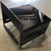 A black metal cart with two drawers and an open shelf on casters.
