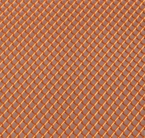 IMG_4523 Close-up of an orange chain-link fence.