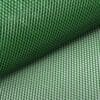 IMG_4533 Green mesh netting material rolled out on a surface.