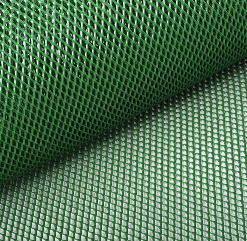 IMG_4533 Green mesh netting material rolled out on a surface.
