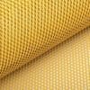 IMG_4534 Close-up of a yellow plastic mesh roll with diamond-shaped holes.