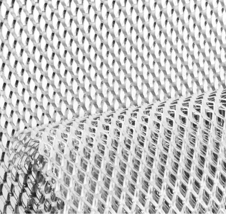 Close-up of a textured, silver metallic mesh fabric.