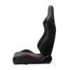 IMG_4766 Black ergonomic gaming chair with red accents and high backrest.
