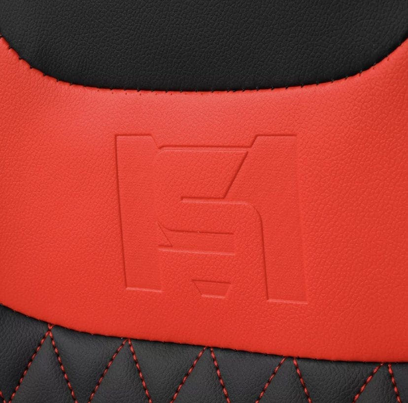 IMG_4962 Close-up of red and black leather with embossed logo and red stitching.