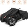 Black cover protecting a three-wheeled vehicle from weather elements.