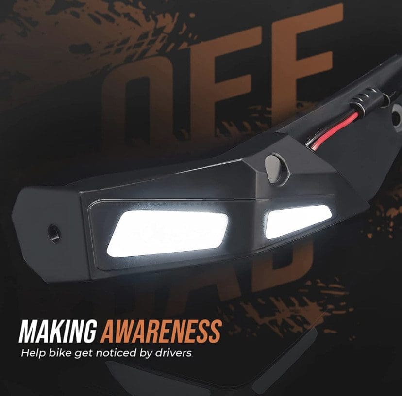 IMG_5316 A close-up of a black safety device with bright lights and a message about making awareness.