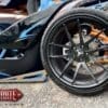 Close-up of a high-performance car's front wheel and brake system.