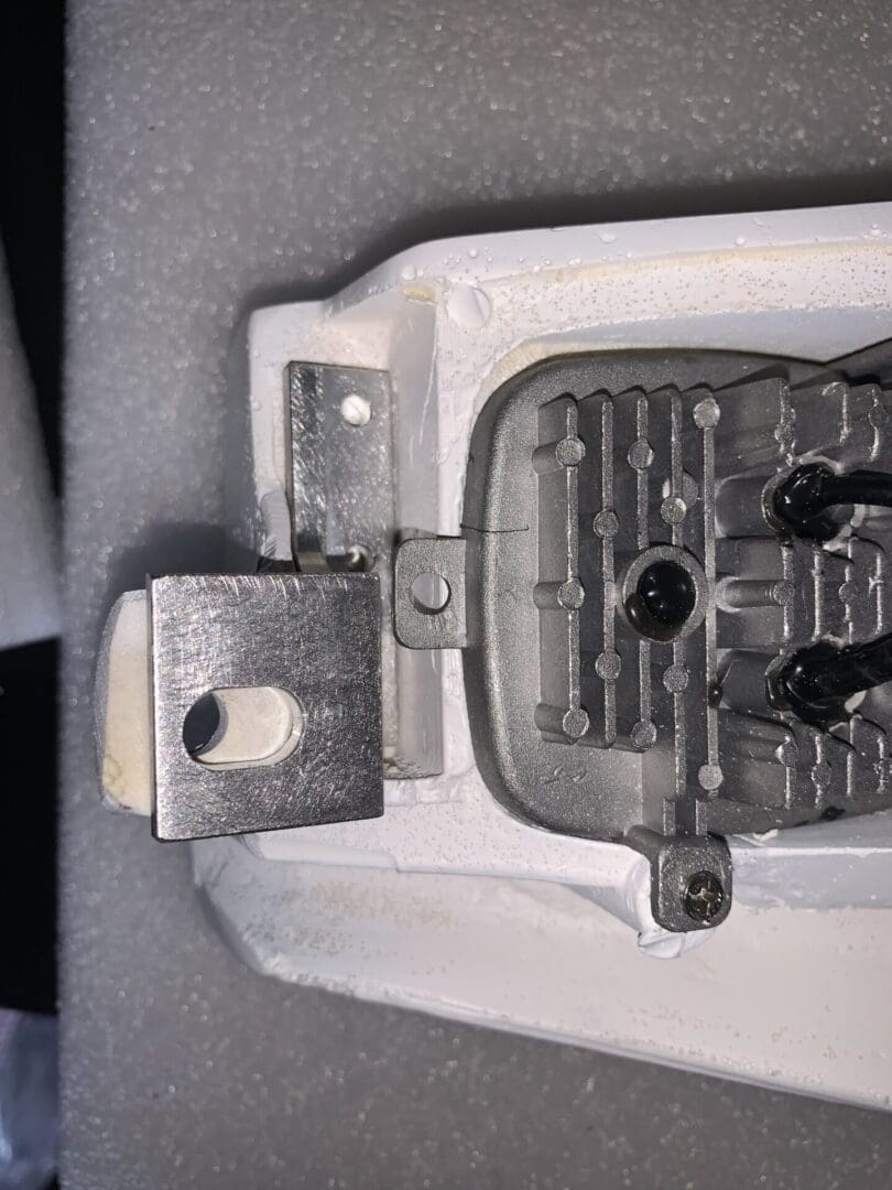 IMG_6733 Close-up of a metal padlock shackle and locking mechanism.