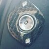 IMG_6985 Close-up of a metallic rotary knob on a carbon fiber base.