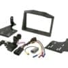 IMG_7409 Car stereo installation kit with wiring harness and mounting brackets.