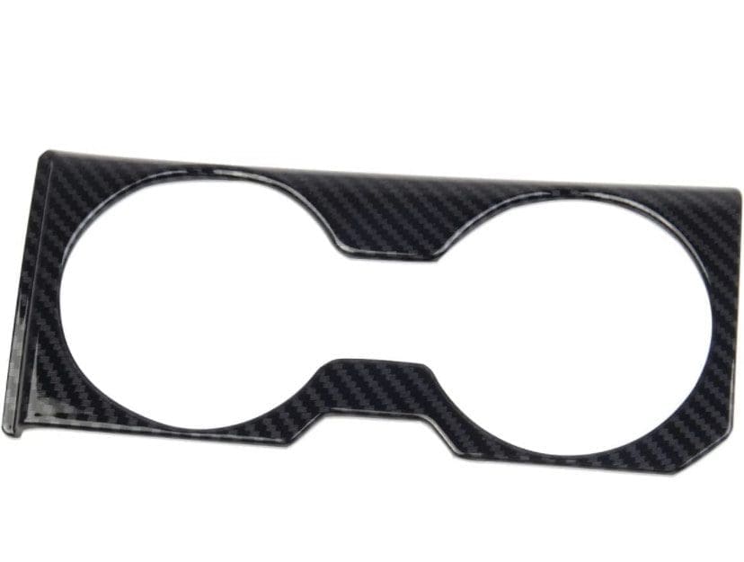 IMG_7417 Carbon fiber car cup holder trim with two circular openings.