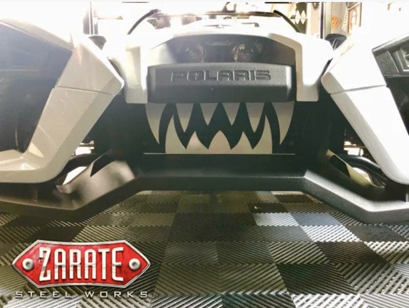IMG_7662 Close-up of a Polaris vehicle with a custom Zarate Steel Works logo and aggressive teeth design.