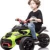 Young boy riding a green and black electric toy quad bike.