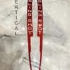 IMG_9696 Red hair sticks labeled 'SLING SHOT' on a marble surface.