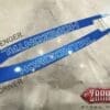 IMG_9697 Two blue wristbands with motivational German text on a surface.