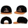 IMG-0259 Black and orange baseball caps with a logo on the front.