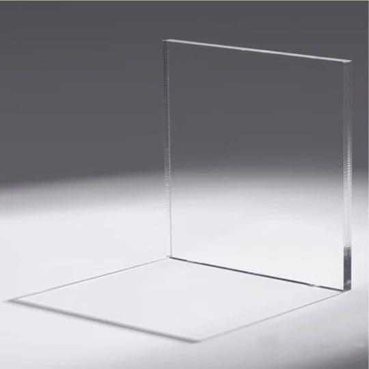 Clear A transparent glass panel casting a shadow on a gray surface.
