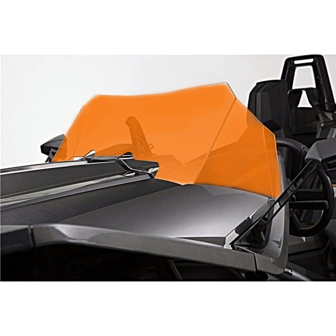 OEM MAIN Windshield A sleek black race car with an orange wind deflector behind the driver's seat.
