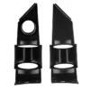 Black plastic mounting brackets with circular and rectangular cutouts.