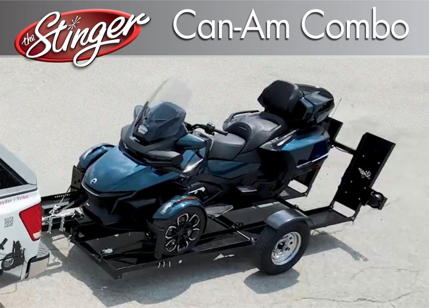 A blue Can-Am Spyder motorcycle on a trailer ready for transport.