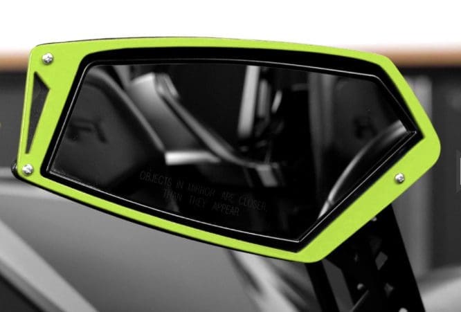 IMG-1701 Close-up of a sleek green and black electric scooter's handle and display.