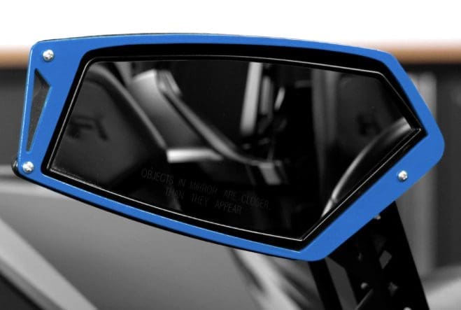 IMG-1702 Close-up of a sleek blue and black car side mirror.