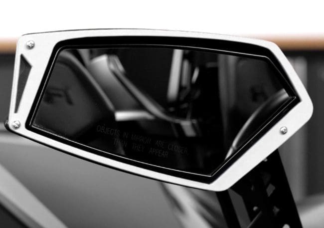 IMG-1704 (1) Close-up of a sleek car side mirror with a modern design.
