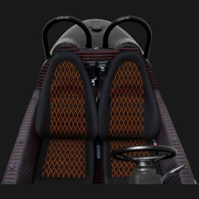Close-up of a car seat with a unique honeycomb pattern and a mounted speaker.