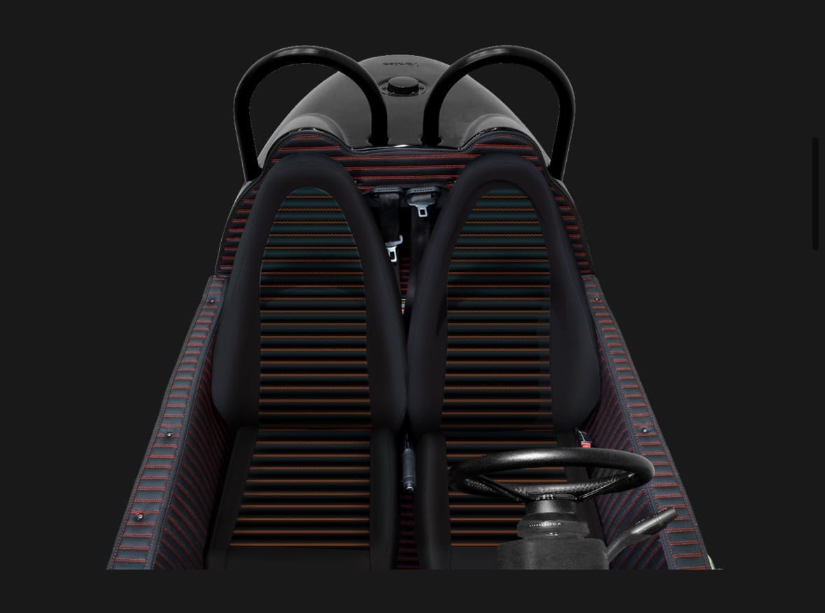 img_0900 Top view of a luxury convertible car with sleek black seats.