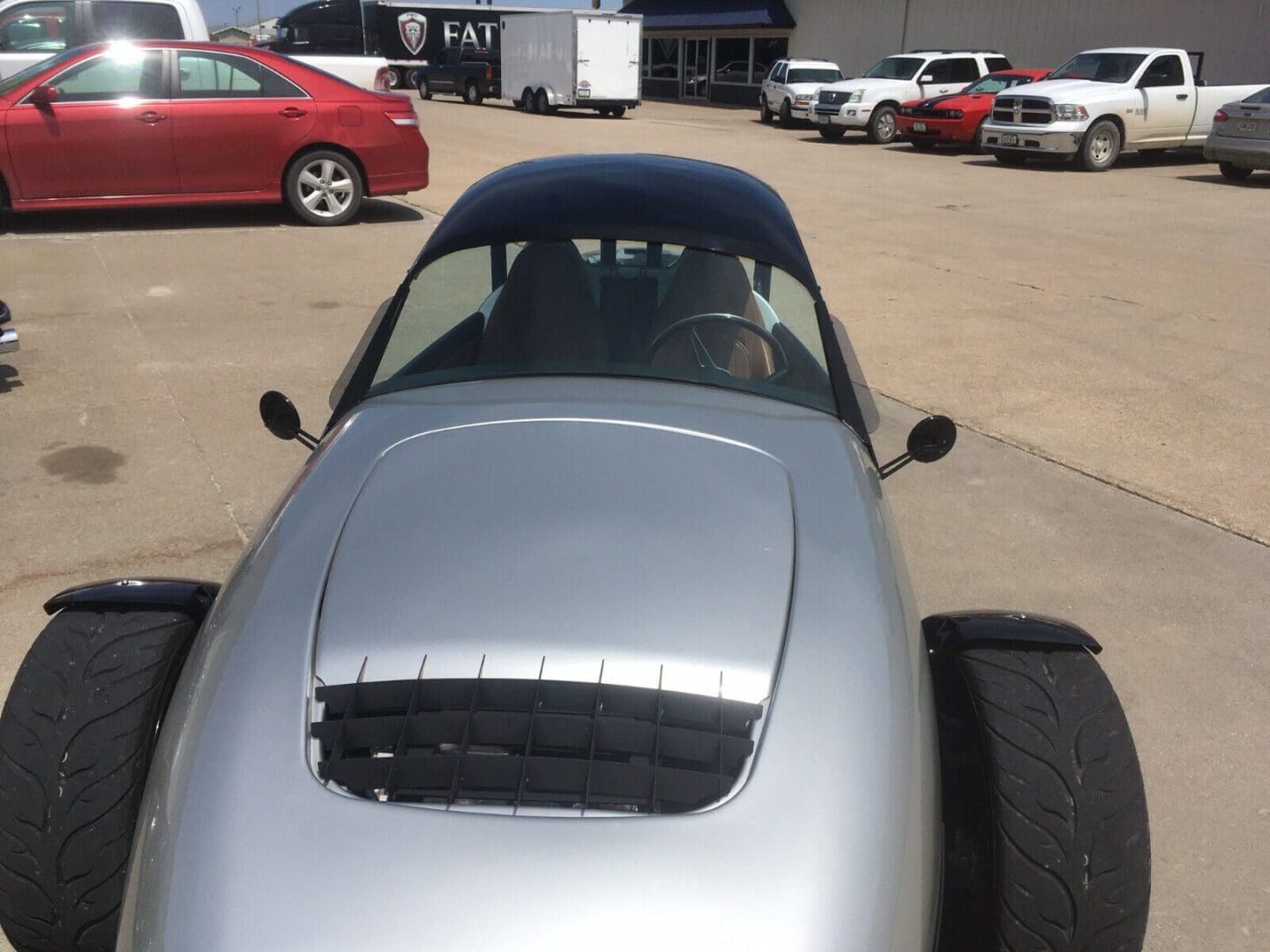 s-l1600 (6) Silver sports car parked outdoors with a vented hood.