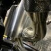 Close-up of a metallic exhaust pipe with welding details.