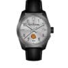 Wristwatch with a silver face and black leather strap.