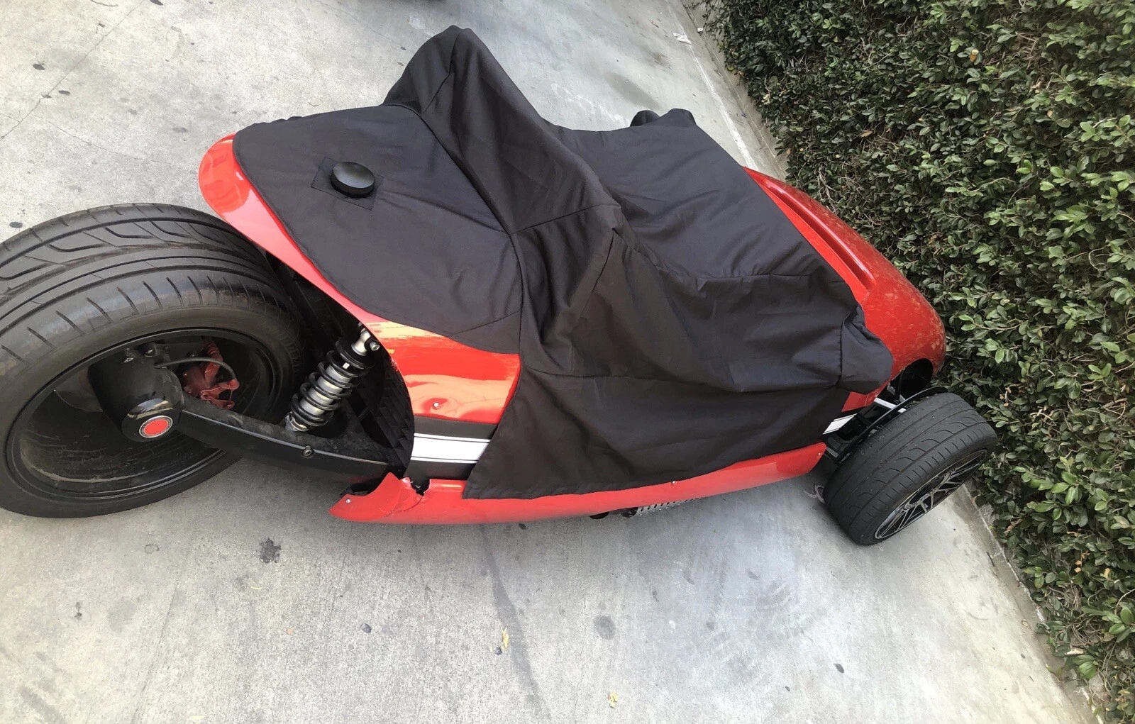 s-l1600 Electric go-kart covered with a black protective tarp.