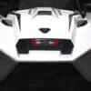 IMG_0908 Close-up of a sleek white sports car's rear end with sharp angles and a central exhaust.
